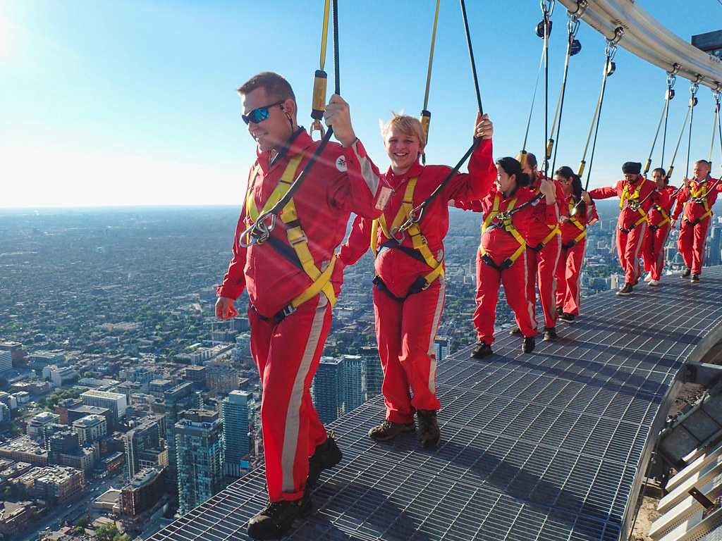 People walk on Toronto's EdgeWalk